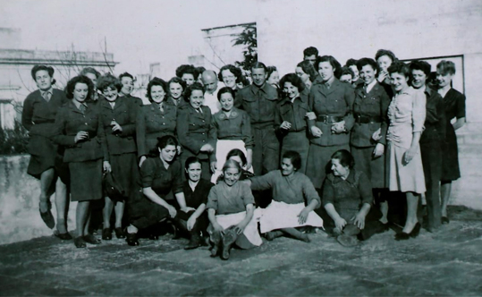 Mildred Schultz, third from the right in a white dress, with her co-workers during Christmas 1944. Source: Telegraph.co.uk